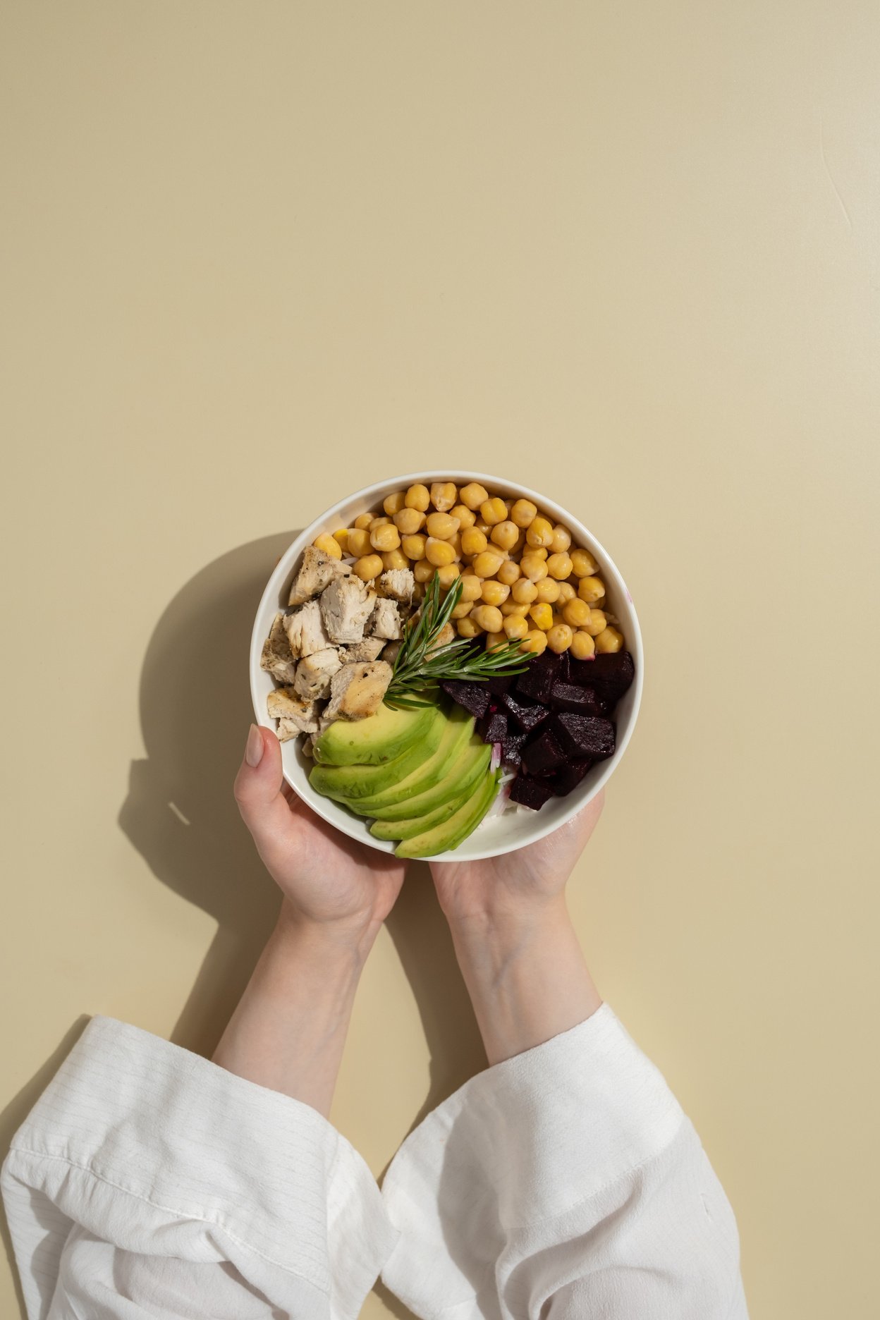 Person Holding a Buddha Bowl Flatlay