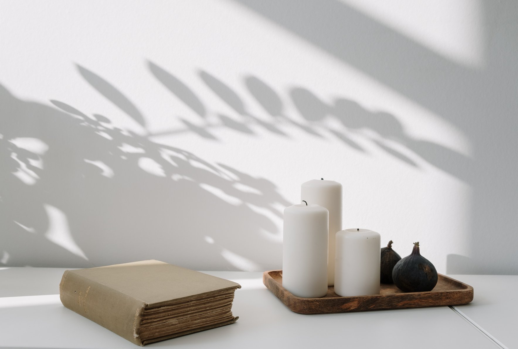 White Candles on Brown Wooden Tray